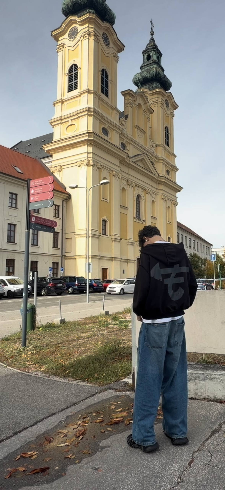 Railoveu standing in an old town square